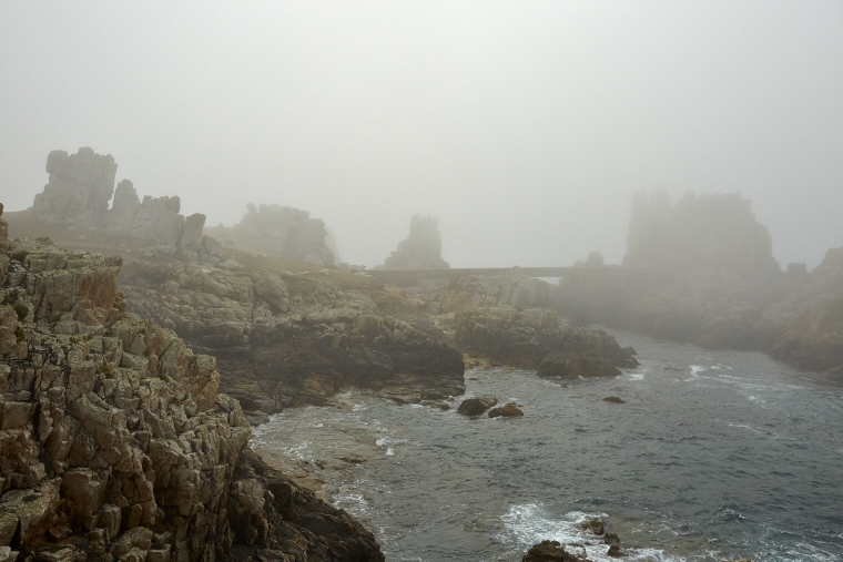 Beneath the blanket of fog, the coast of Ouessant is more visible than it is revealed - pure mystery and beauty, where the sea and the sky merge.