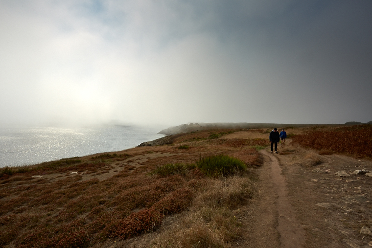 Beneath the blanket of fog, the coast of Ouessant is more visible than it is revealed - pure mystery and beauty, where the sea and the sky merge.