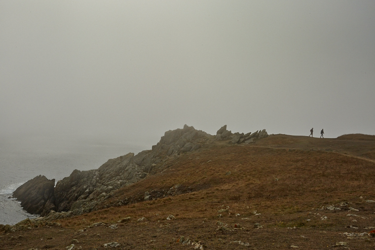 Beneath the blanket of fog, the coast of Ouessant is more visible than it is revealed - pure mystery and beauty, where the sea and the sky merge.