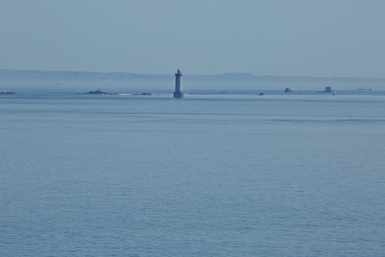 Standing on its promontory, the Créac'h lighthouse illuminates the night of Ouessant. Its light guides sailors and watches over storms, an immutable witness to the dialogue between sky and sea.